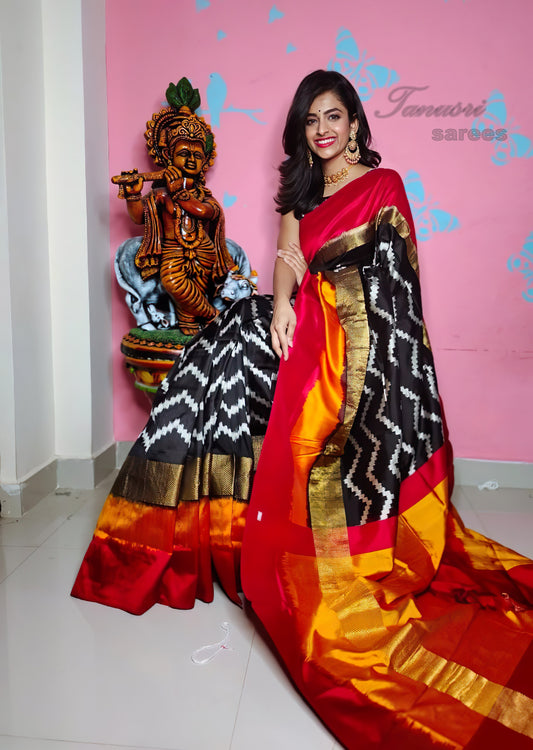 Dynamic Contrast: The Black Zigzag and Red Ikat Patola Silk Saree