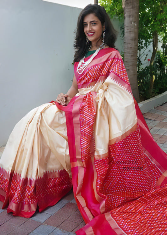 Graceful Contrasts: The Cream and Red Ikat Patola Silk Saree